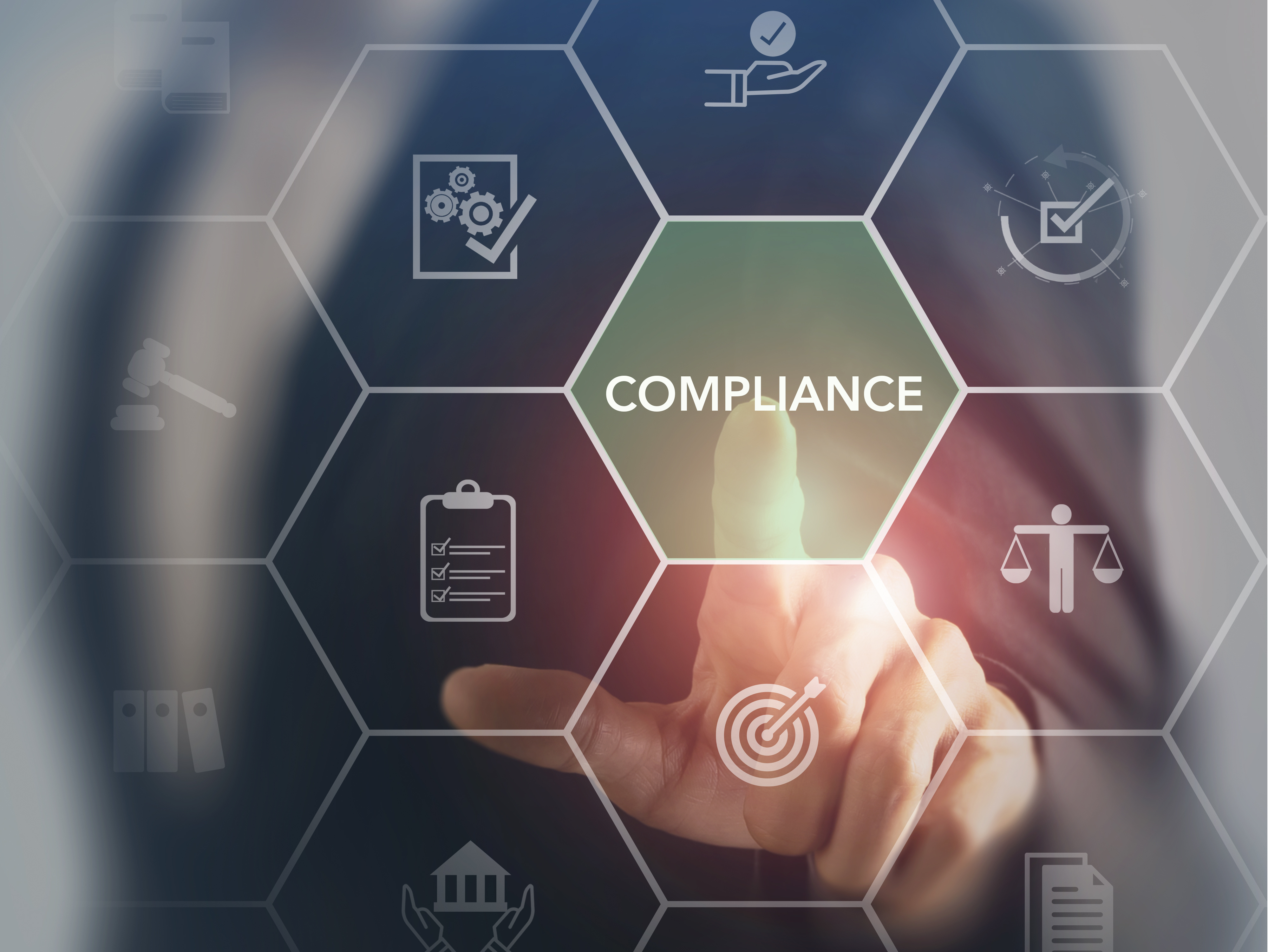 Person touching a holographic element with the word "Compliance" in it.