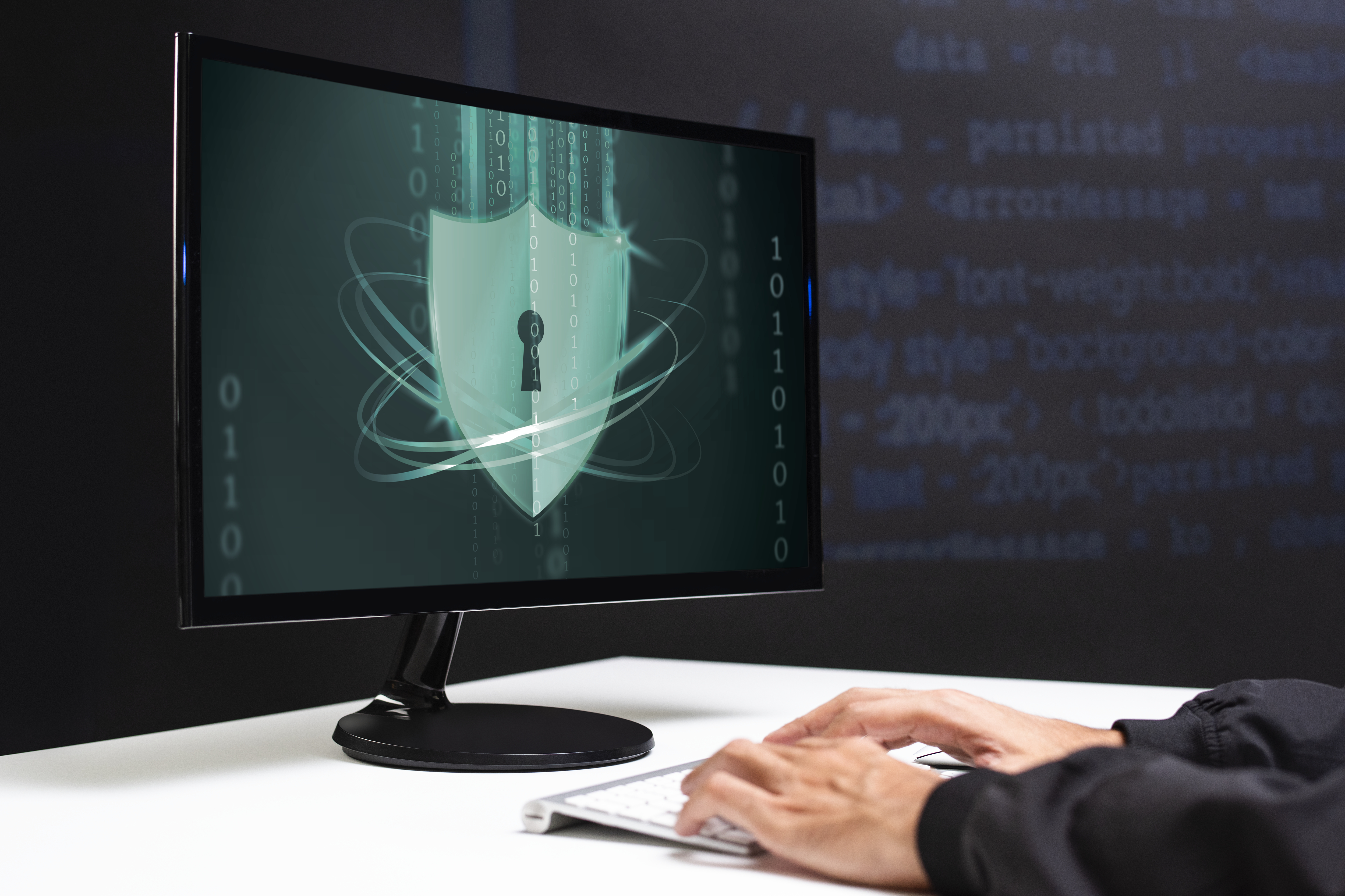 Image of a computer monitor with a shield and lock