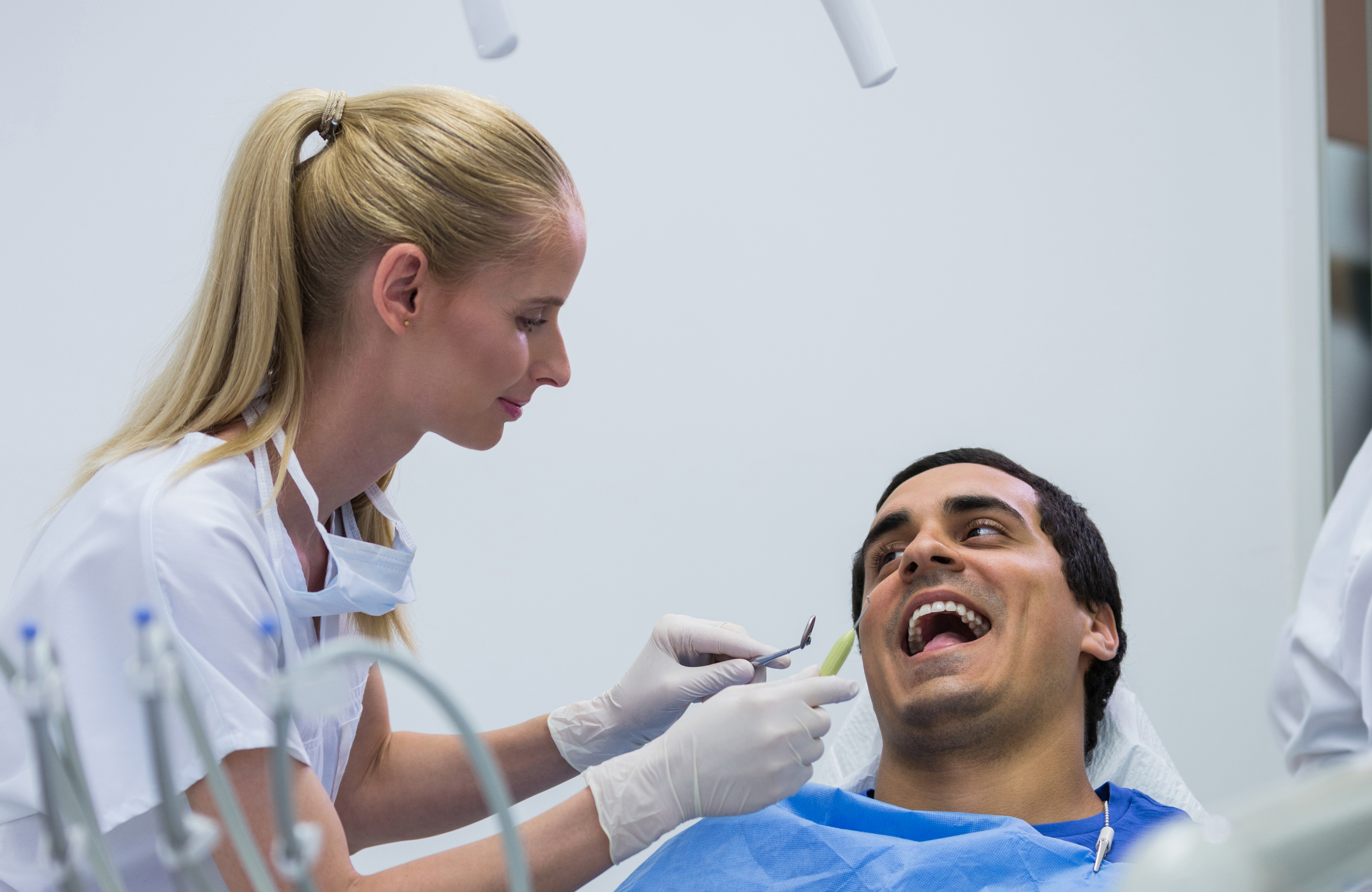Dentist with a patient cleaning teeth