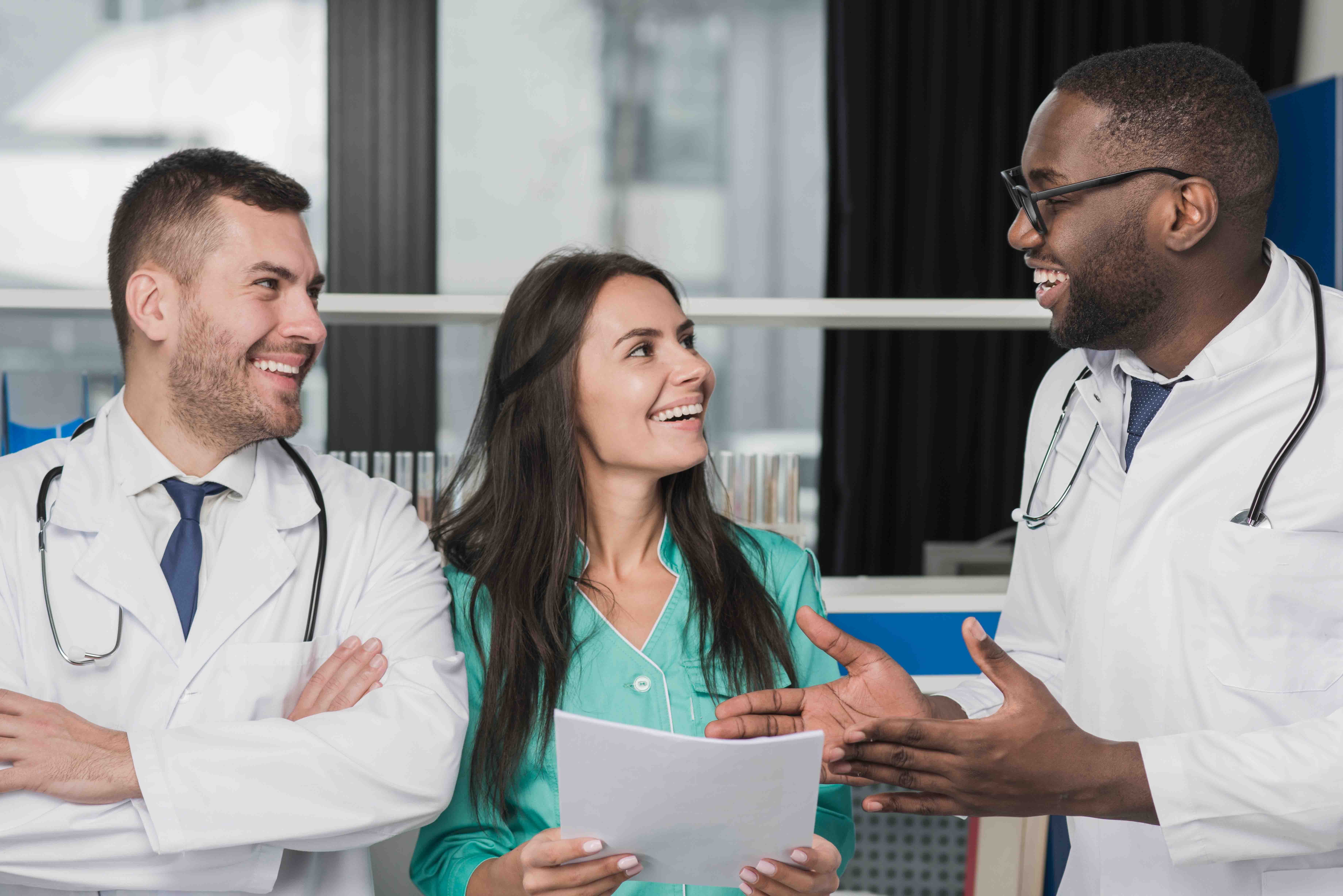 Doctor's talking to a patient smiling.
